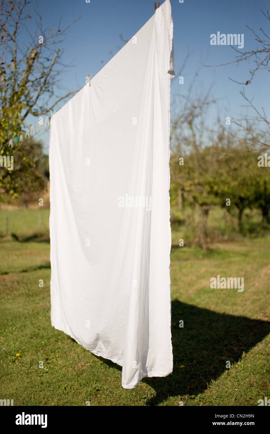 Sheet drying on washing line Stock Photo - Alamy