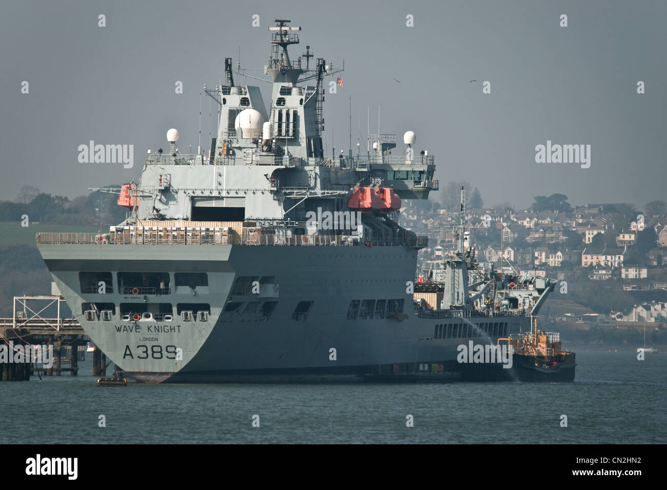 A Royal Fleet Auxiliary ship being loaded up in Devonport Docks Stock Photo