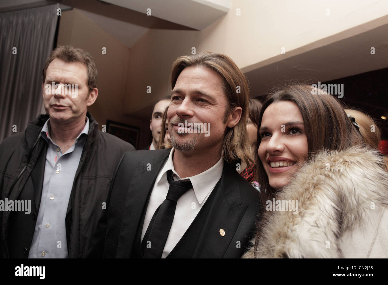 Actor Brad Pitt poses for photo with fan at after party of gala premiere in Sarajevo. Angelina is in Sarajevo for screening of Stock Photo