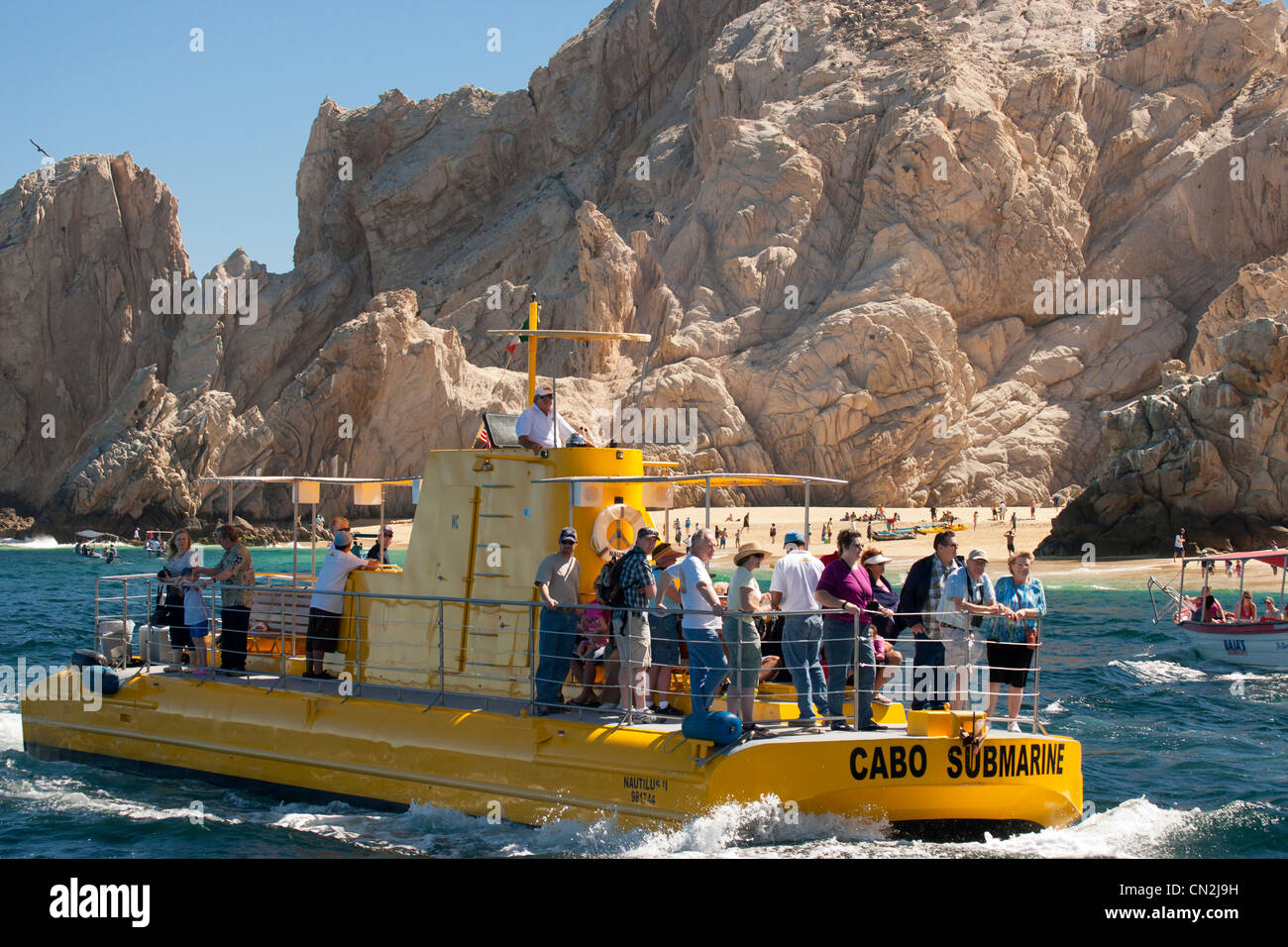 Tourboat and tourists along Coastline of Cabo San Lucas in Sea of Cortez- Cabo San Lucas-Mexico. Stock Photo