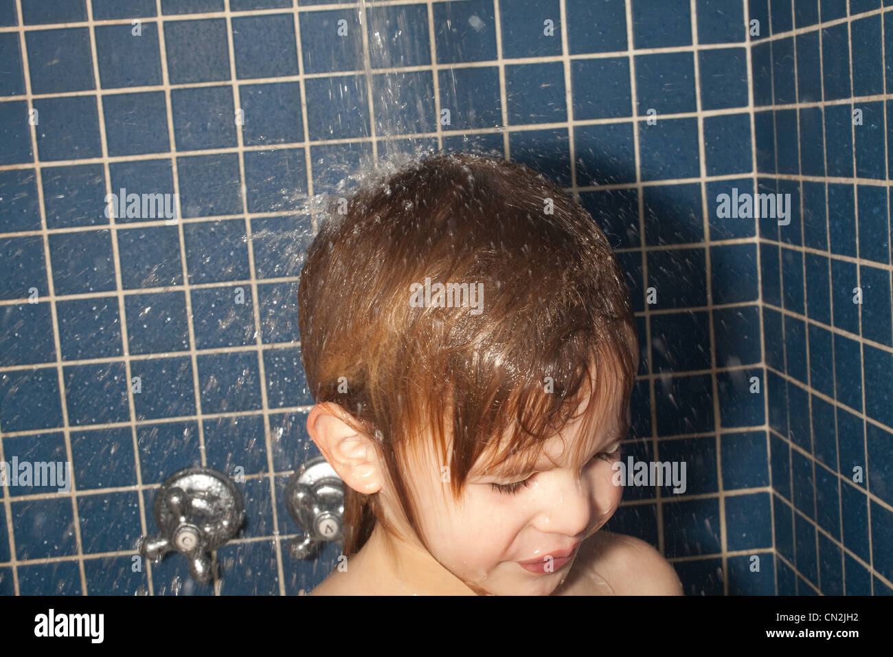 Boy taking a shower Stock Photo Alamy