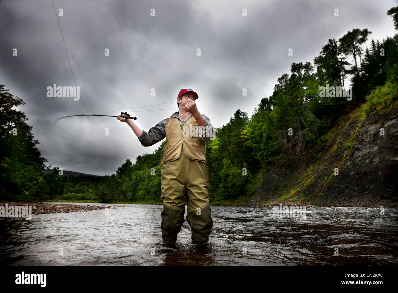 Fly fisherman in Margaree River, Cape Breton Island, Nova Scotia Stock