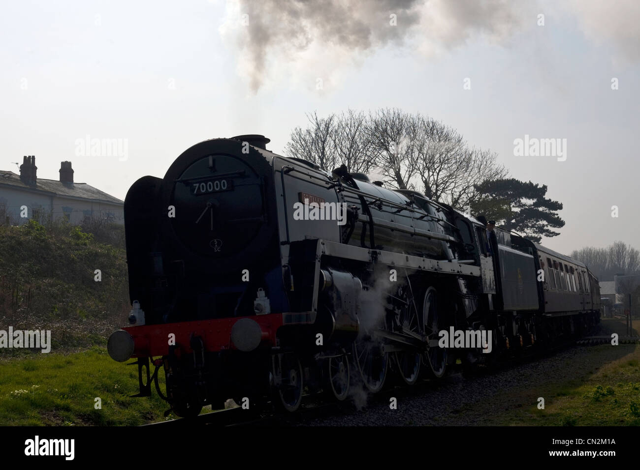 steam train leaving watchet station in somerset Stock Photo