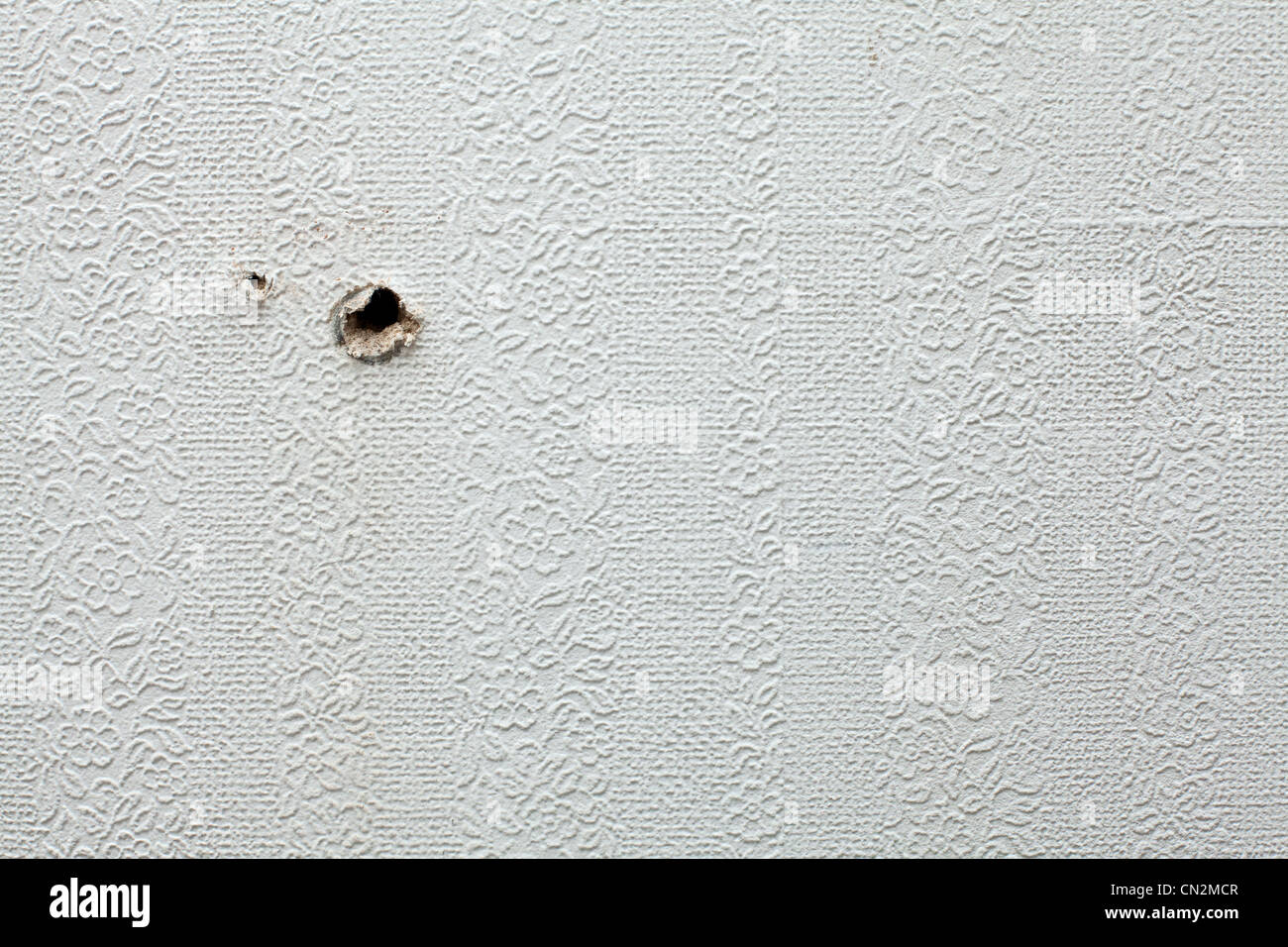Holes in wall Stock Photo Alamy