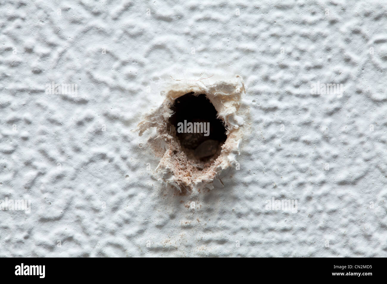 Hole in wall Stock Photo