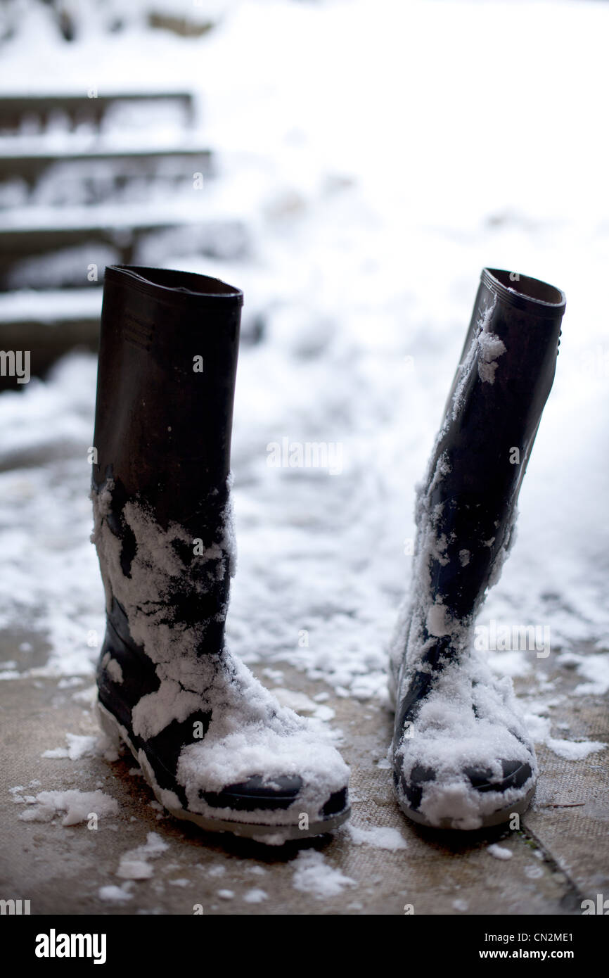Pair of wellington boots in snow Stock Photo Alamy