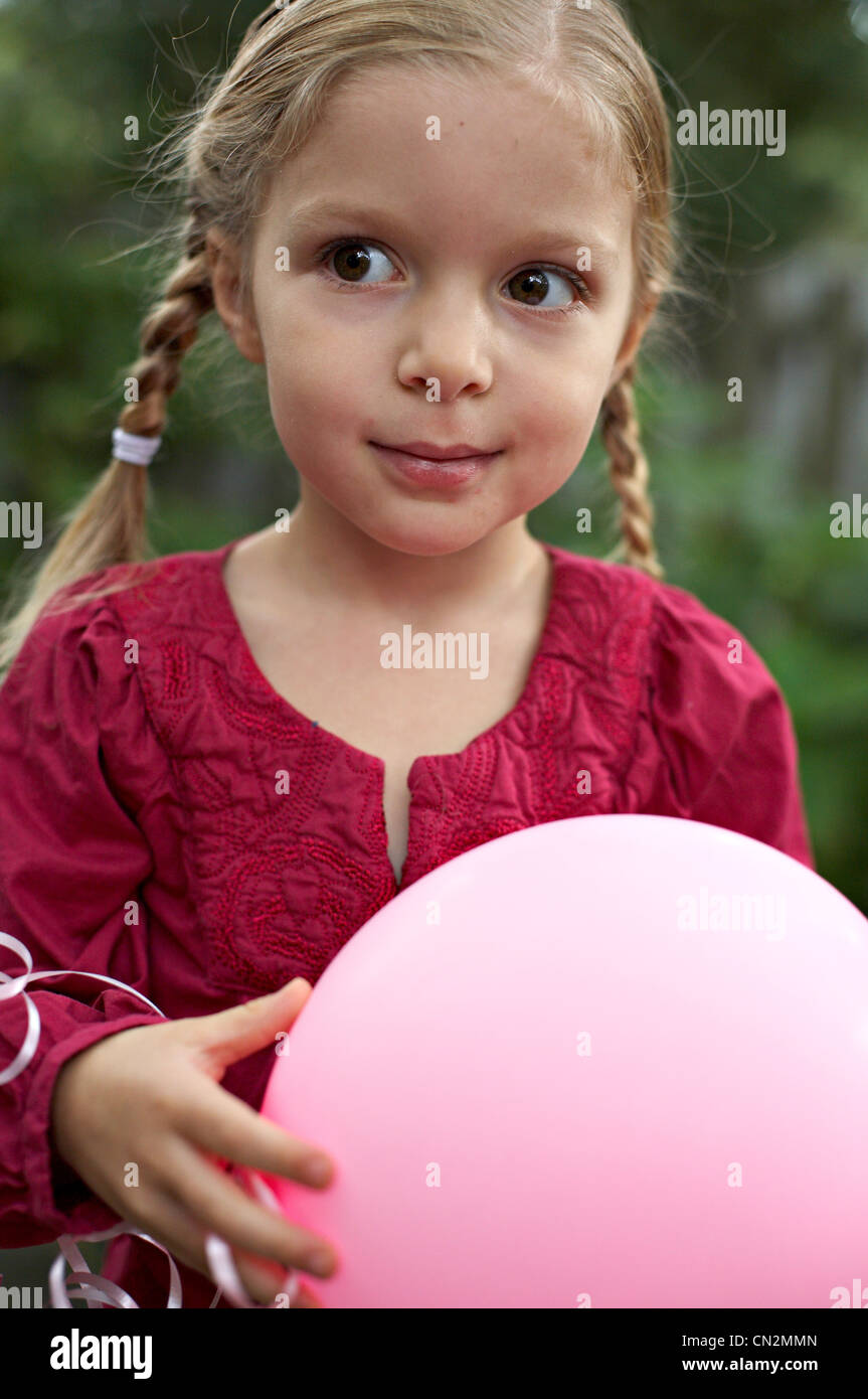 Little Girl with Pink Balloon Stock Photo