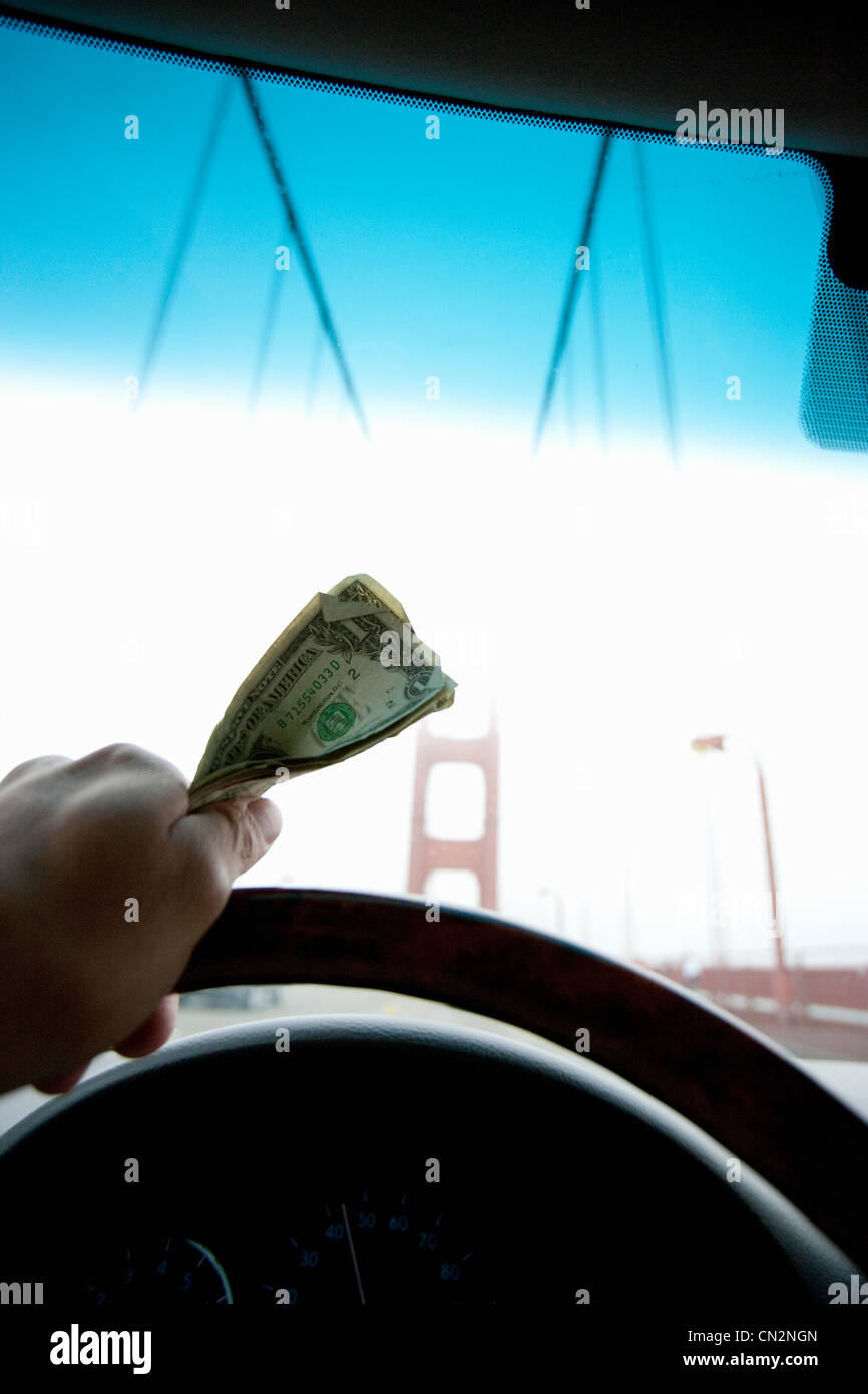 Person holding toll money for Golden Gate Bridge Stock Photo