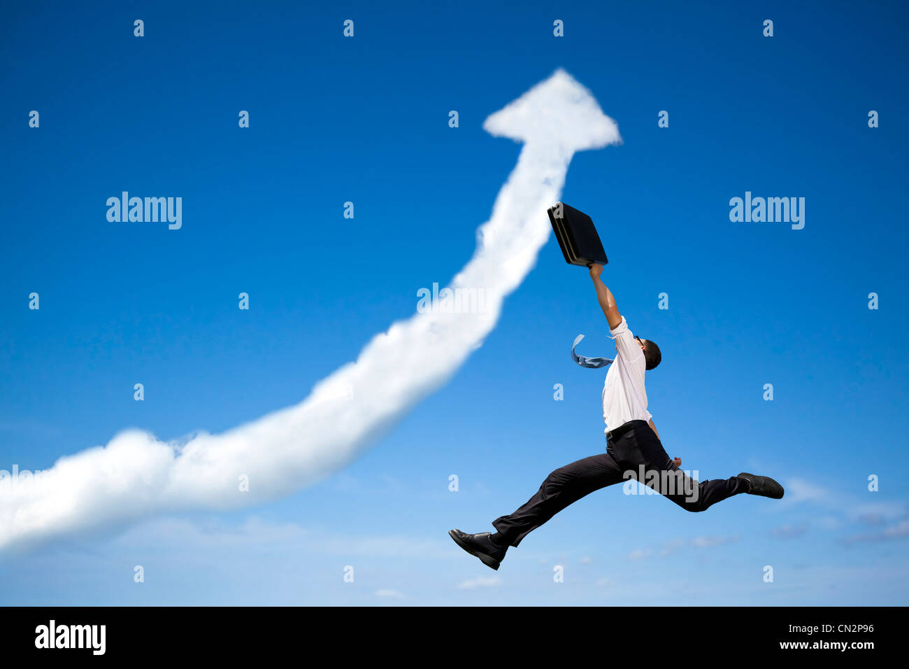 jumping businessman with business growing graph cloud Stock Photo