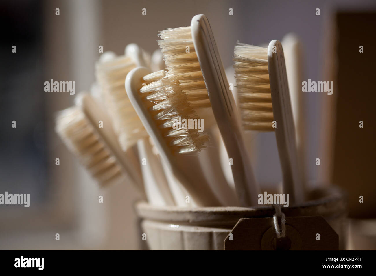 Toothbrushes in pot Stock Photo