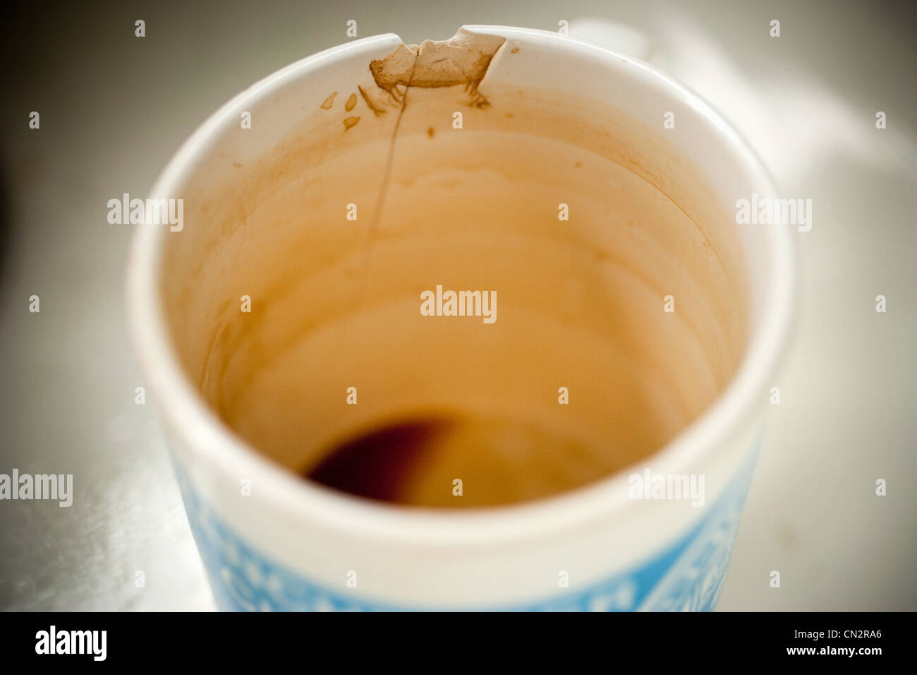 Dirty cracked mug Stock Photo Alamy