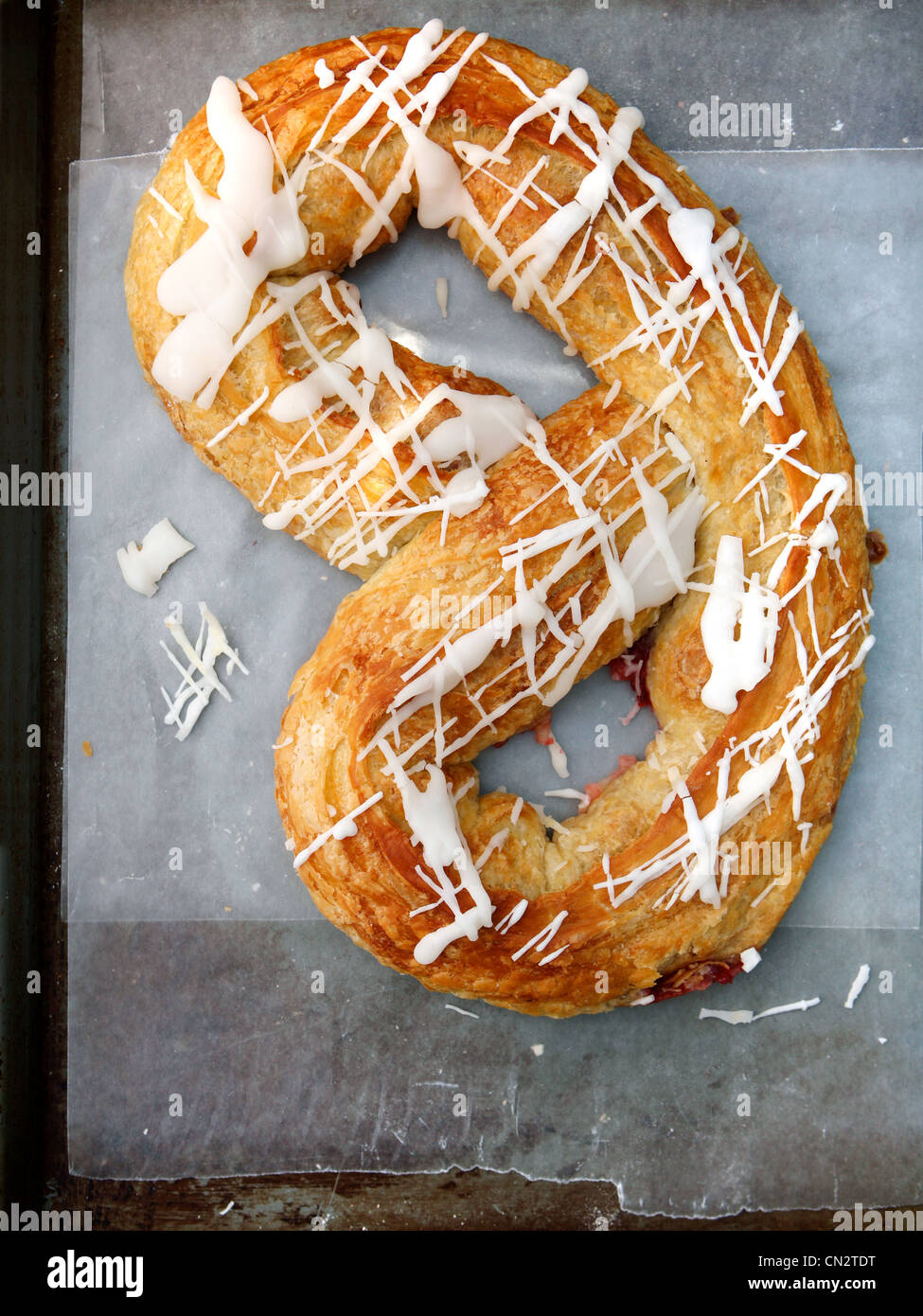 Danish pastry on greaseproof paper Stock Photo