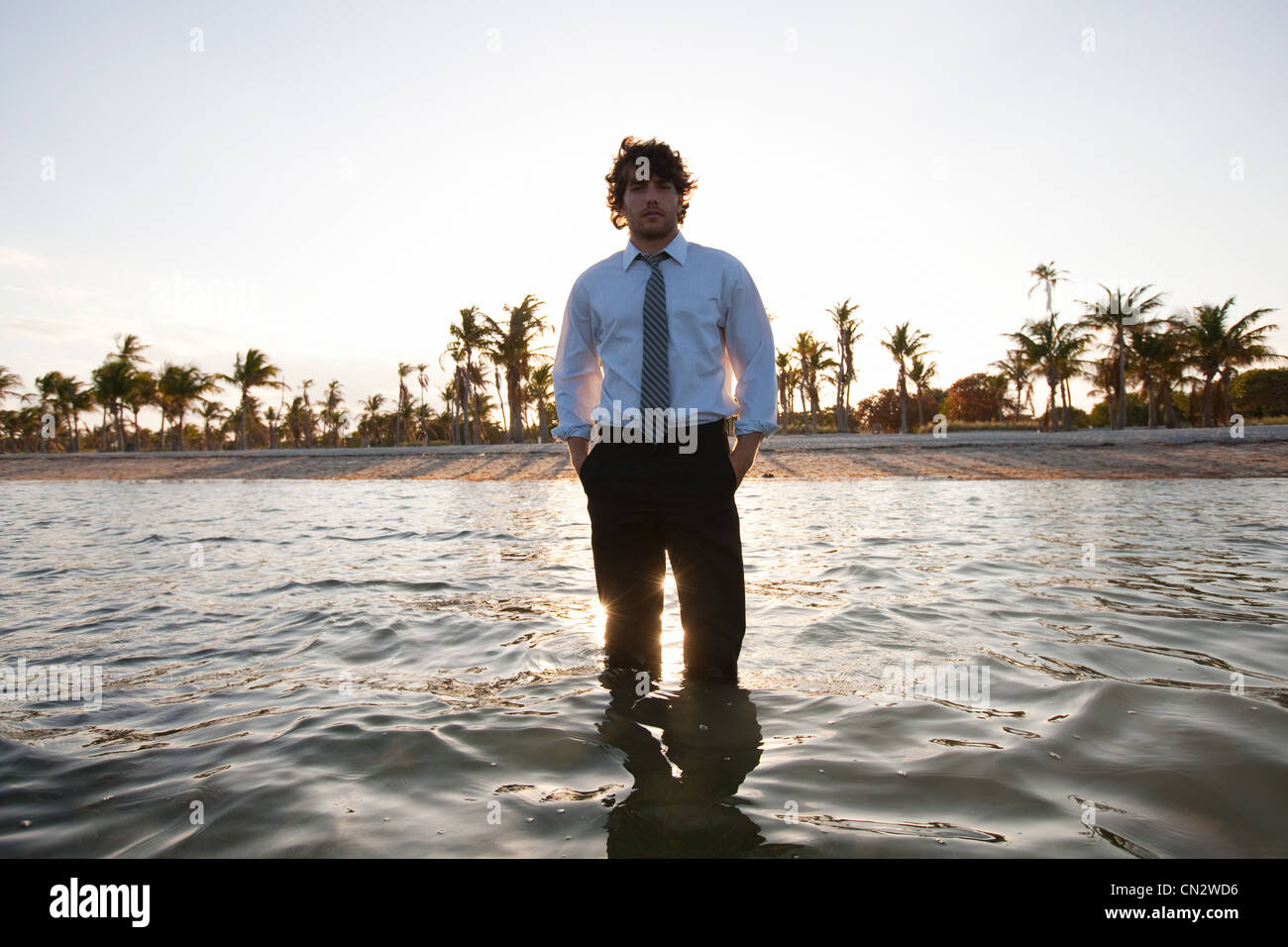 Businessman standing in sea Stock Photo
