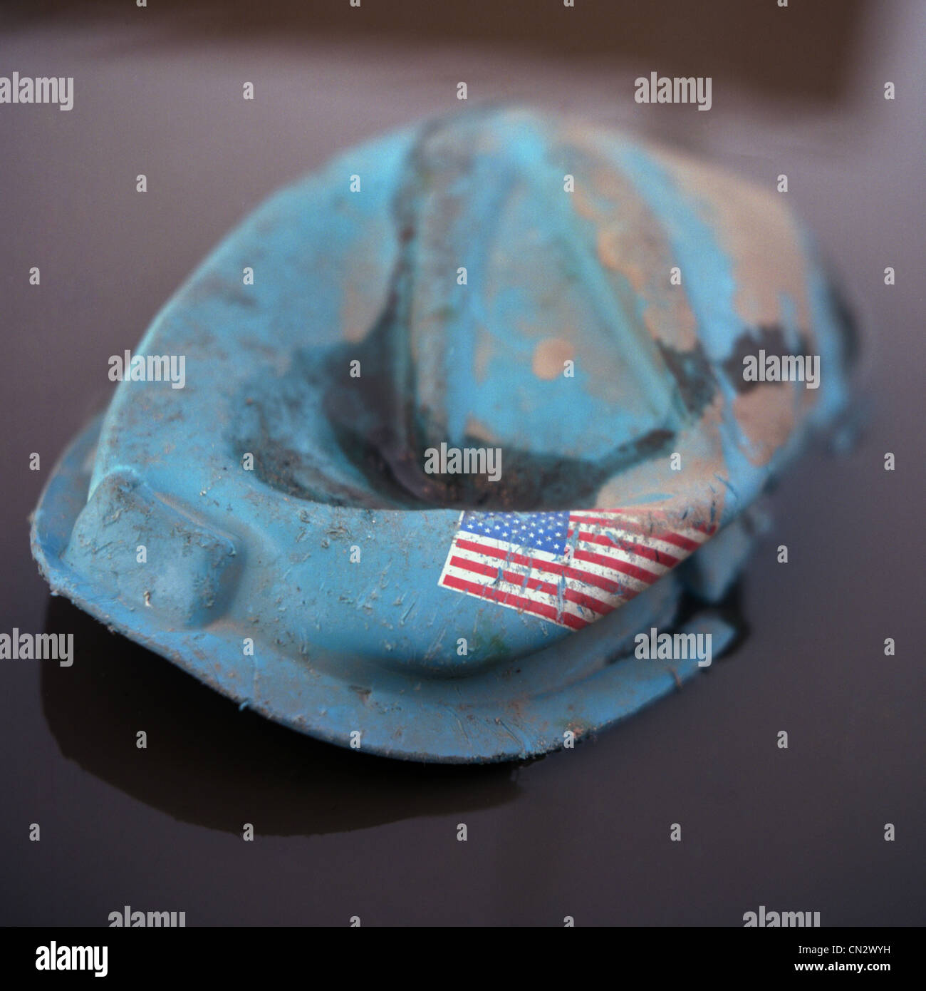 Crushed hard hat with american flag Stock Photo