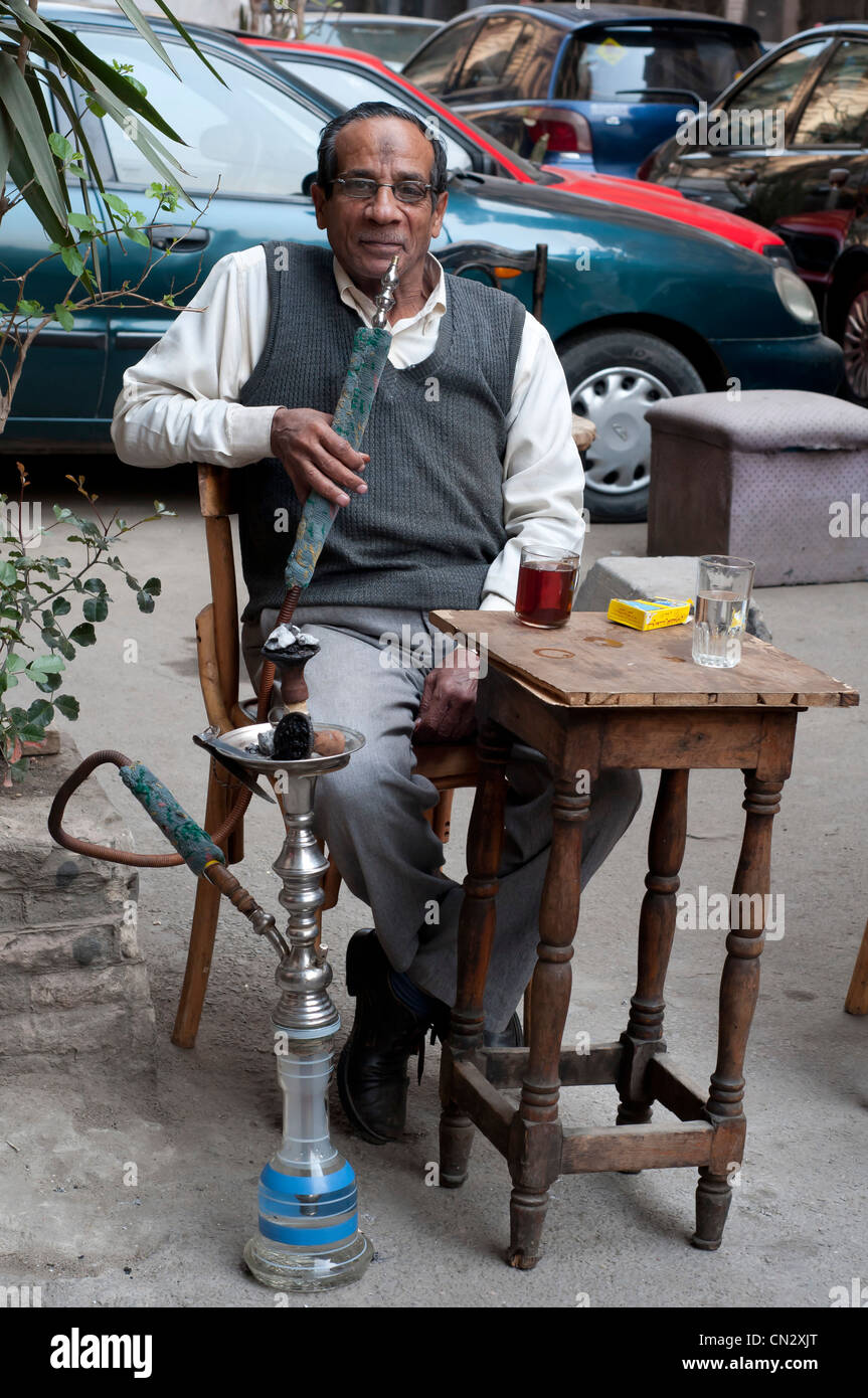 Man smoking water pipe downtown Cairo Egypt Stock Photo Alamy