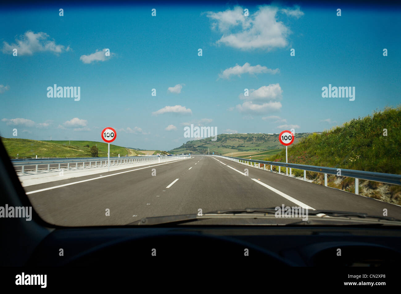 View of road through car windscreen Stock Photo