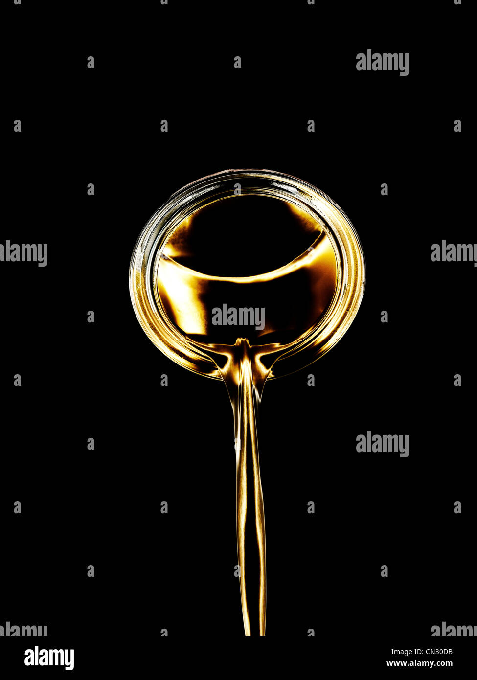 Pouring gold liquid Stock Photo Alamy