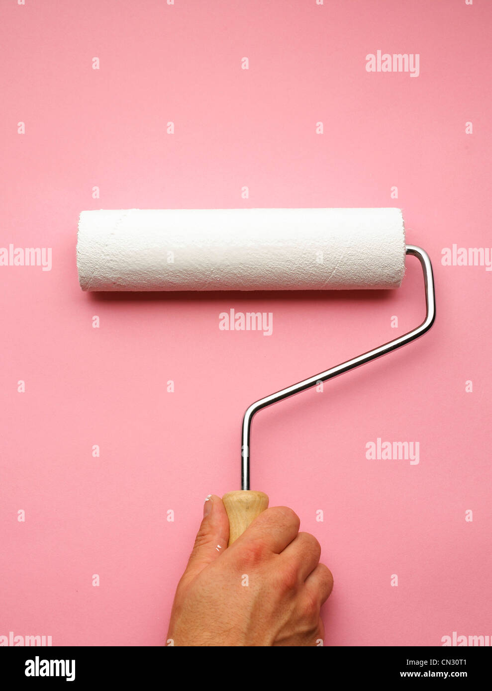 Hand and paint roller Stock Photo Alamy