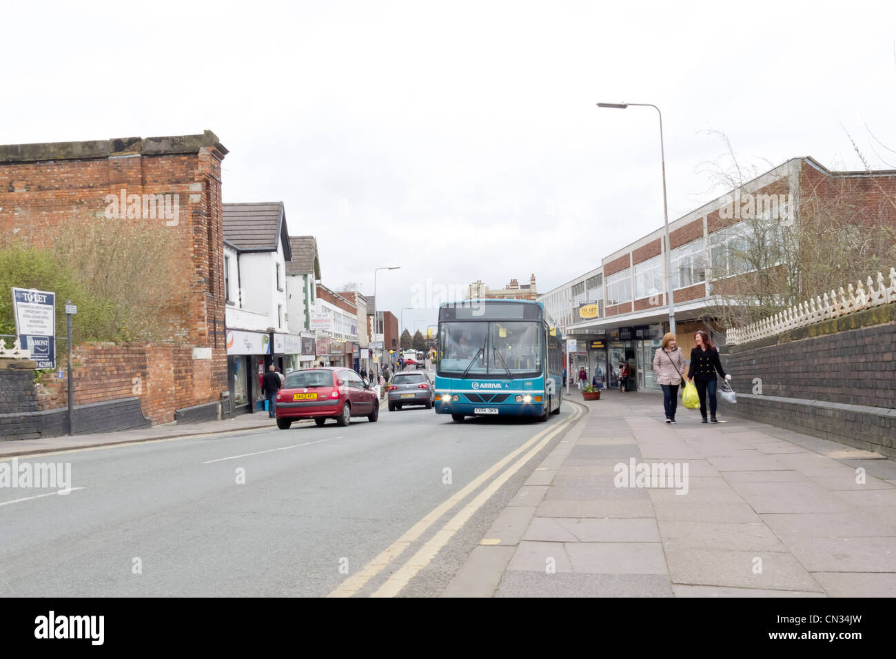 Crewe on a March Saturday a bus on the main road Stock Photo