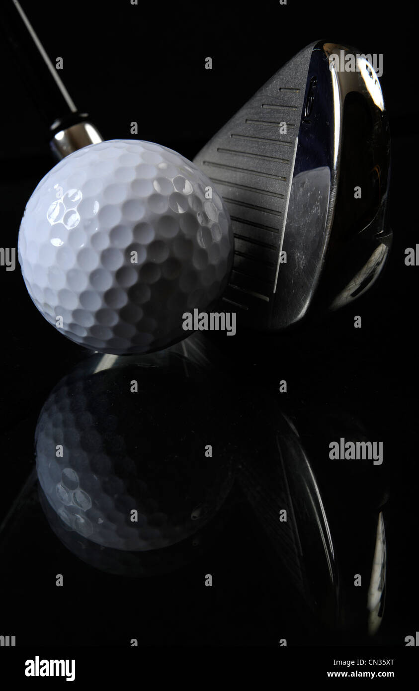 Golf club with ball in the black background Stock Photo - Alamy