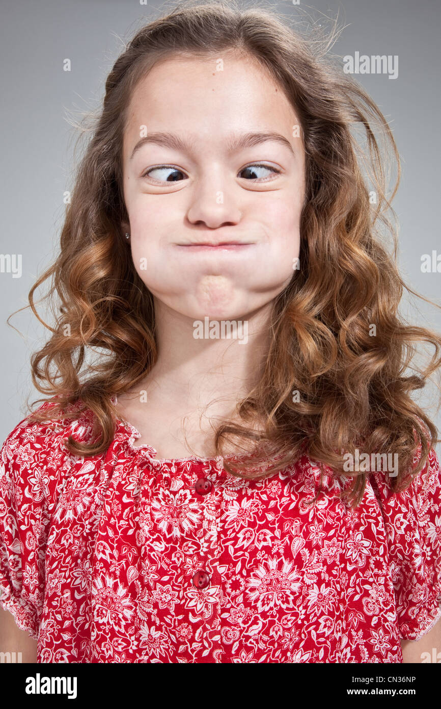 Girl Pulling Funny Face Stock Photo Alamy