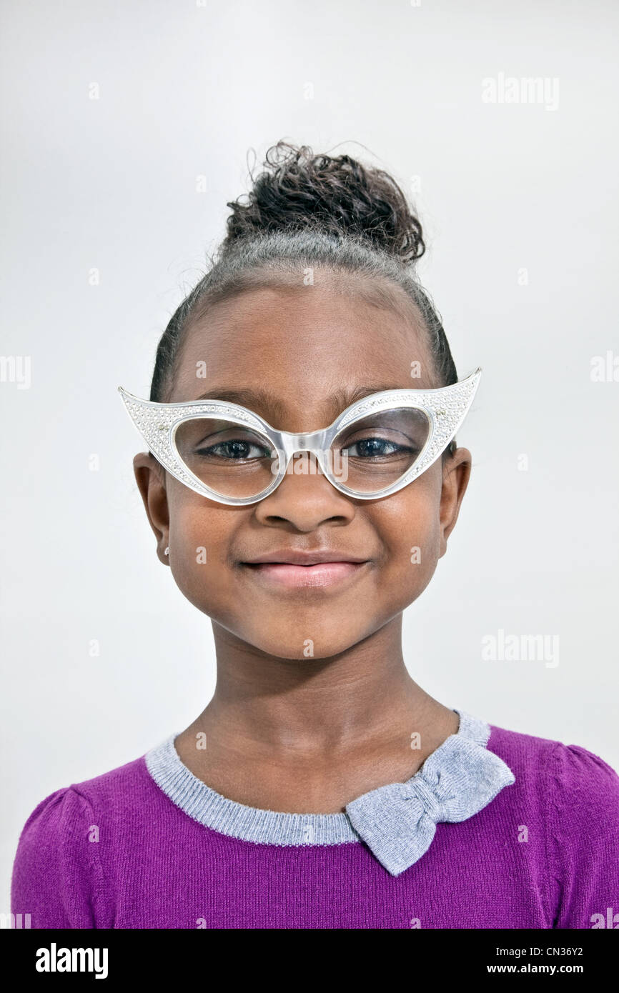 Head and shoulders of girl wearing funny glasses Stock Photo