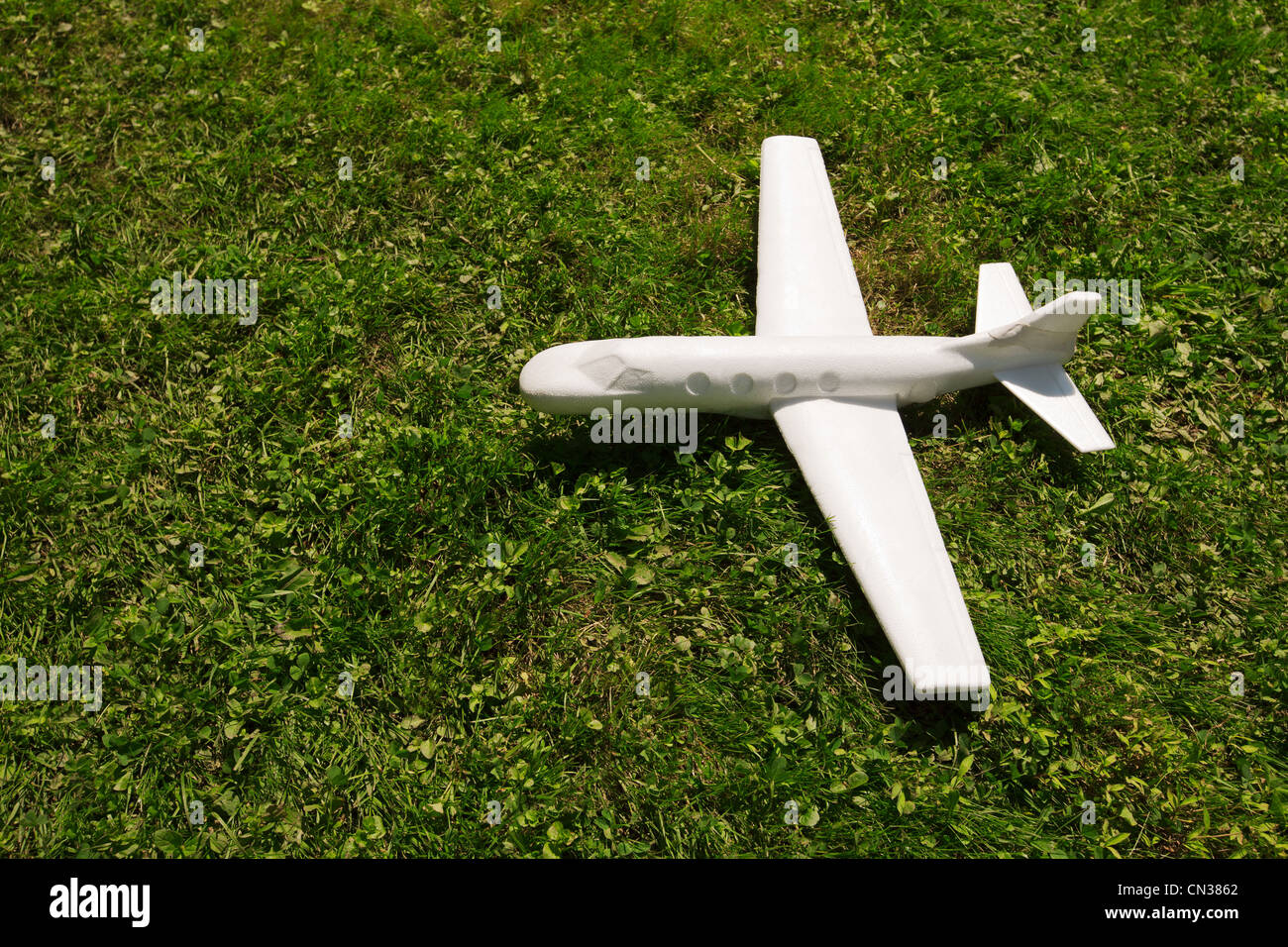 Toy plane on grass Stock Photo
