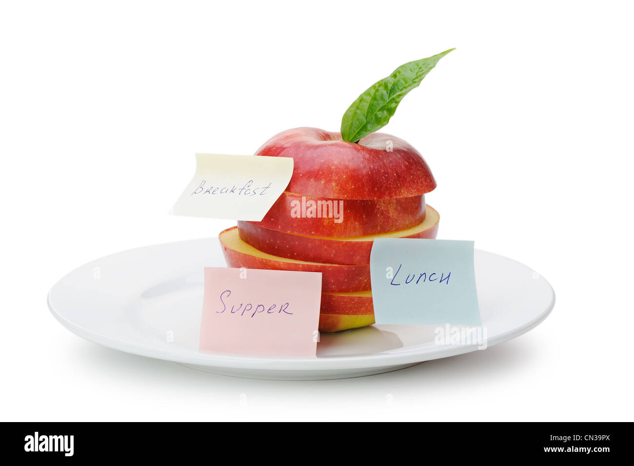 Apple sliced sections with paper notes. Inscriptions on the notes Breakfast, lunch and dinner. The concept of diet Stock Photo