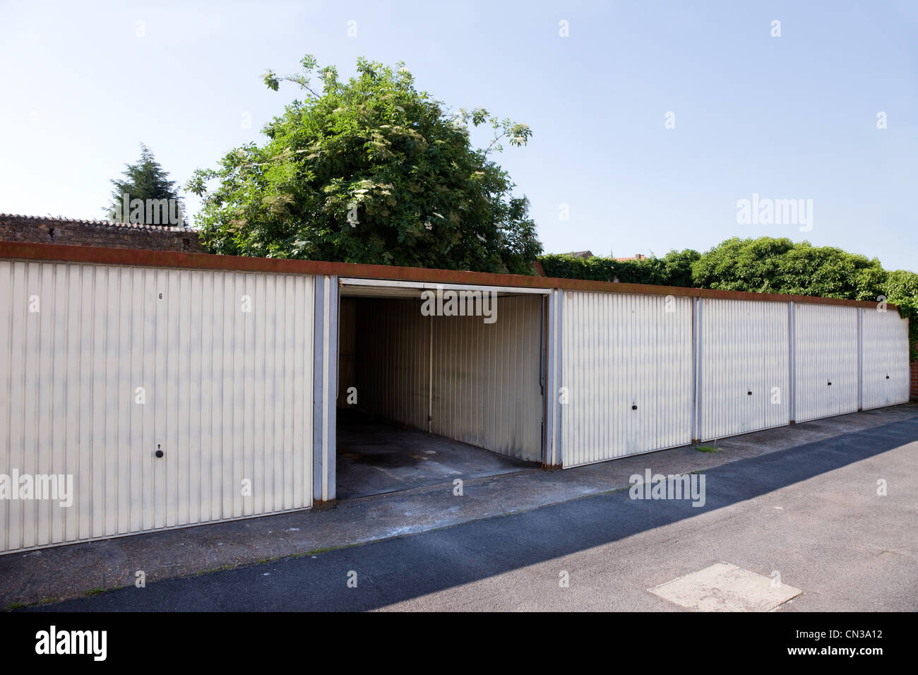 One open garage in row Stock Photo - Alamy