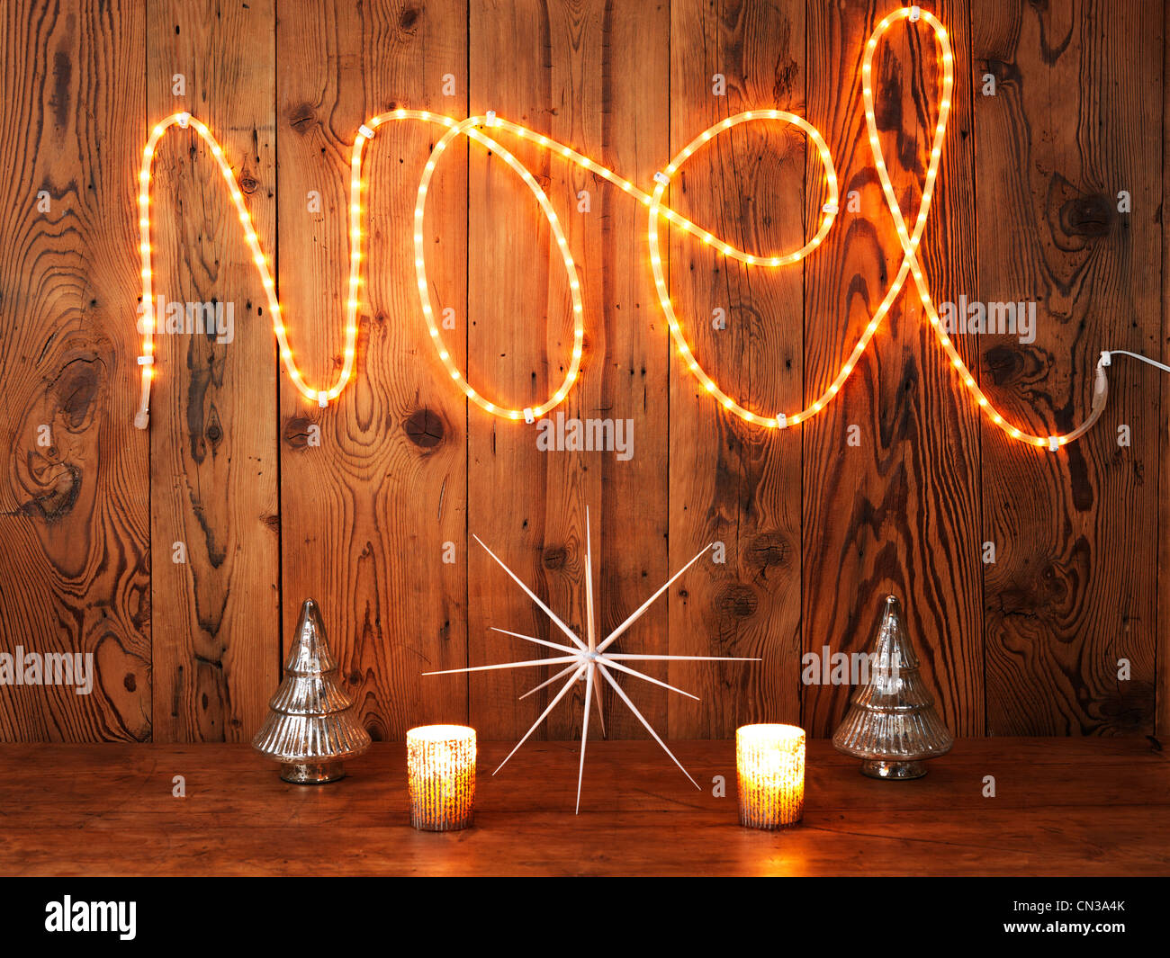 Christmas lights spelling Noel against wood panelling Stock Photo Alamy
