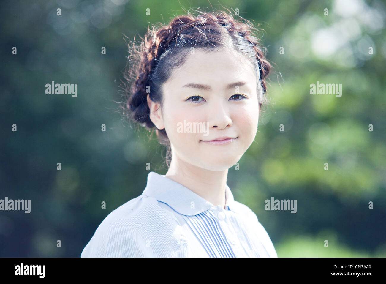 Young woman with plaited hair, portrait Stock Photo