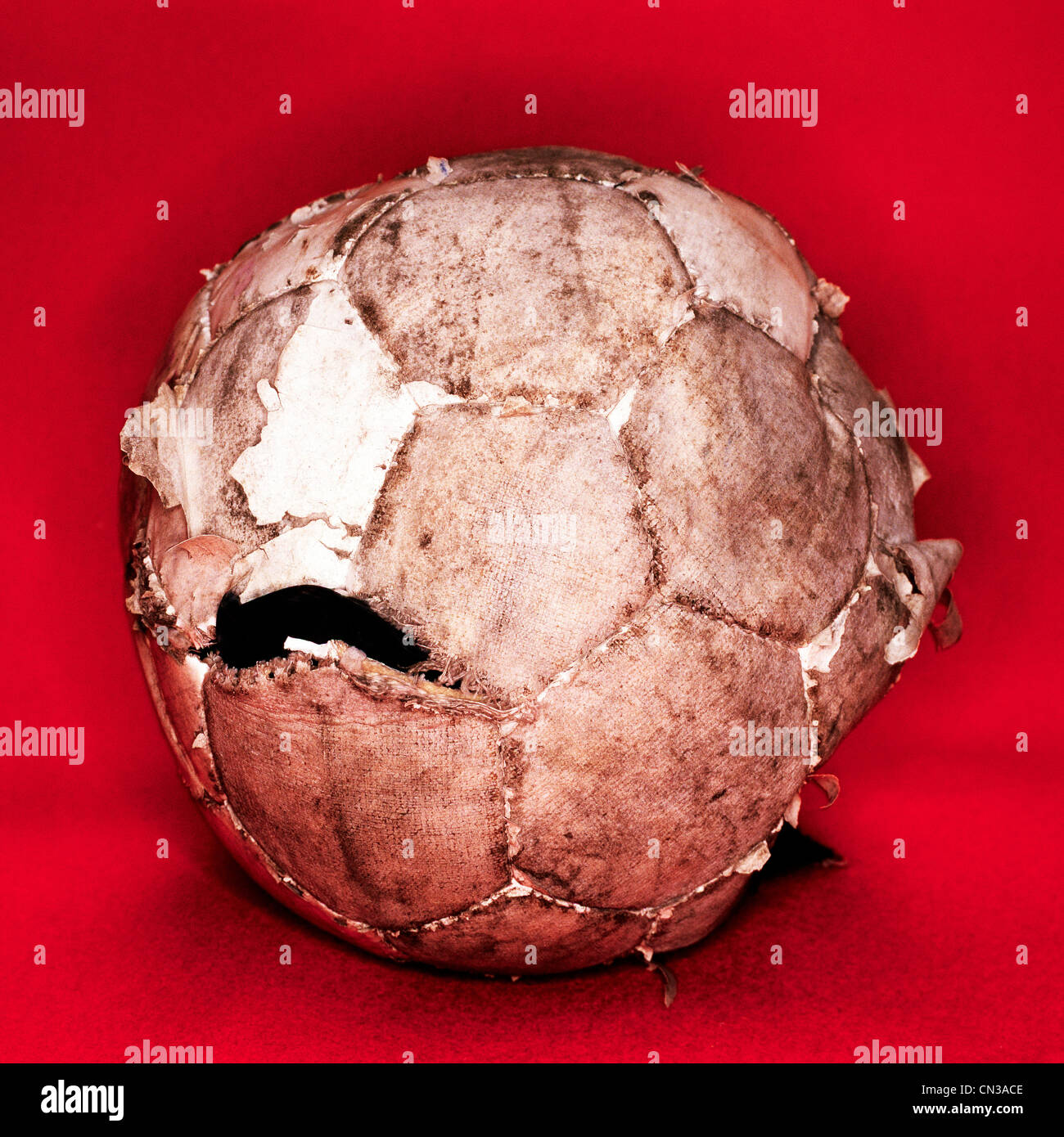 Worn out football Stock Photo