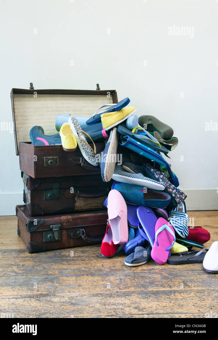 Suitcase full of shoes Stock Photo Alamy