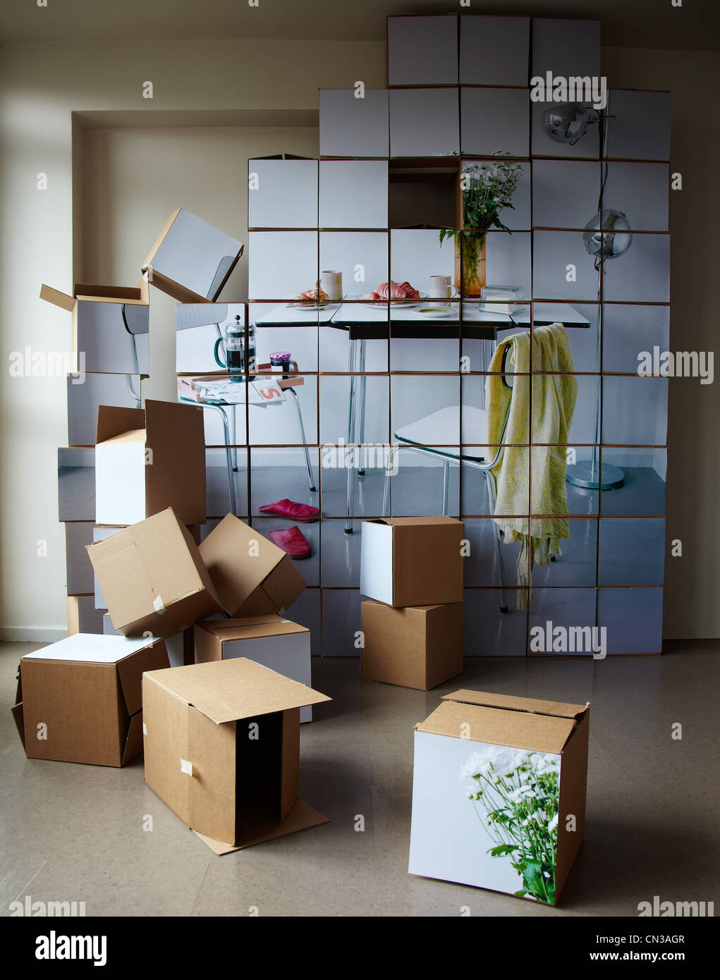 Stack of cardboard boxes with pictures on them Stock Photo