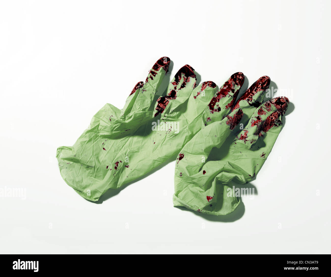 Pair of bloodied surgical gloves Stock Photo