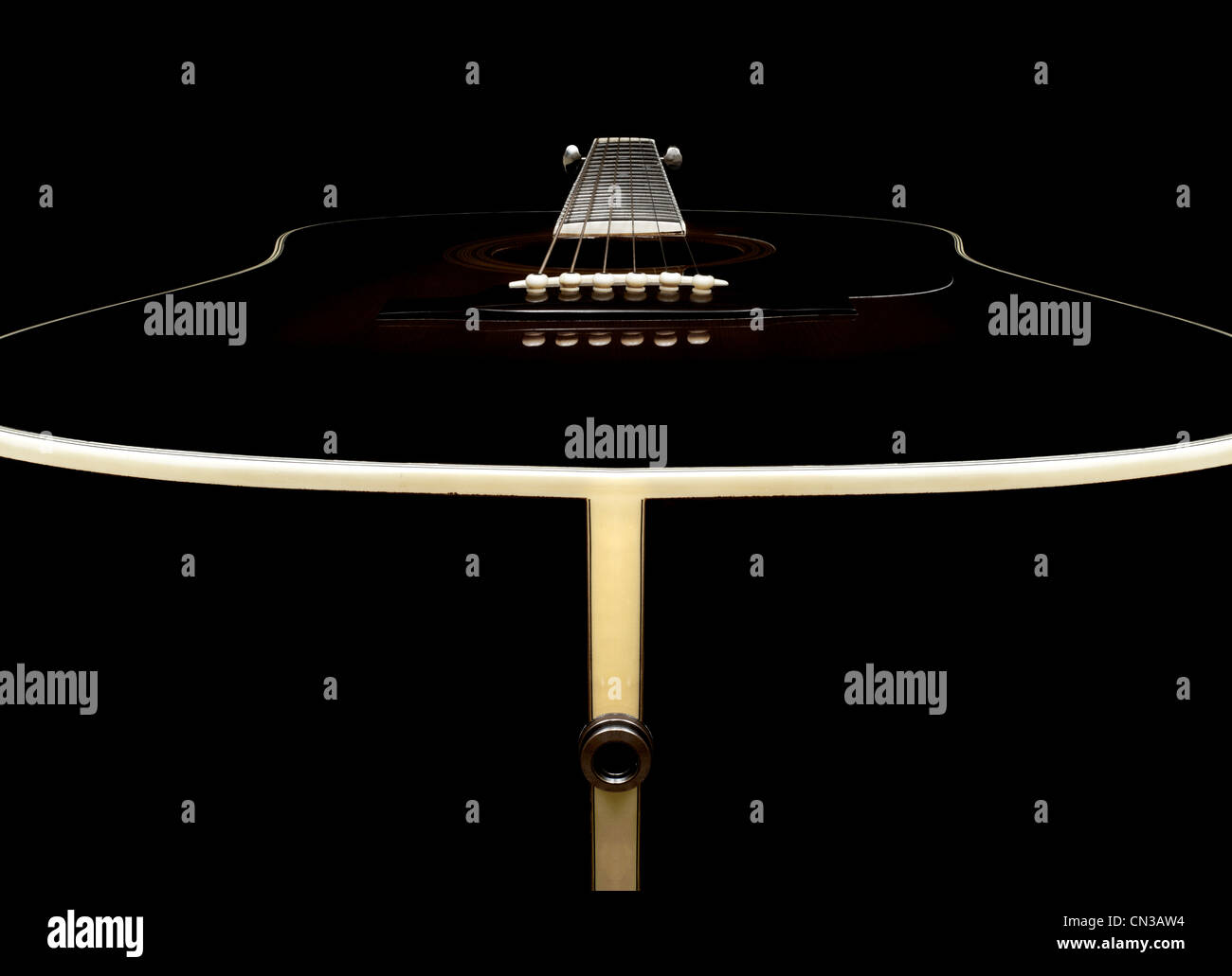 Acoustic guitar against black background Stock Photo