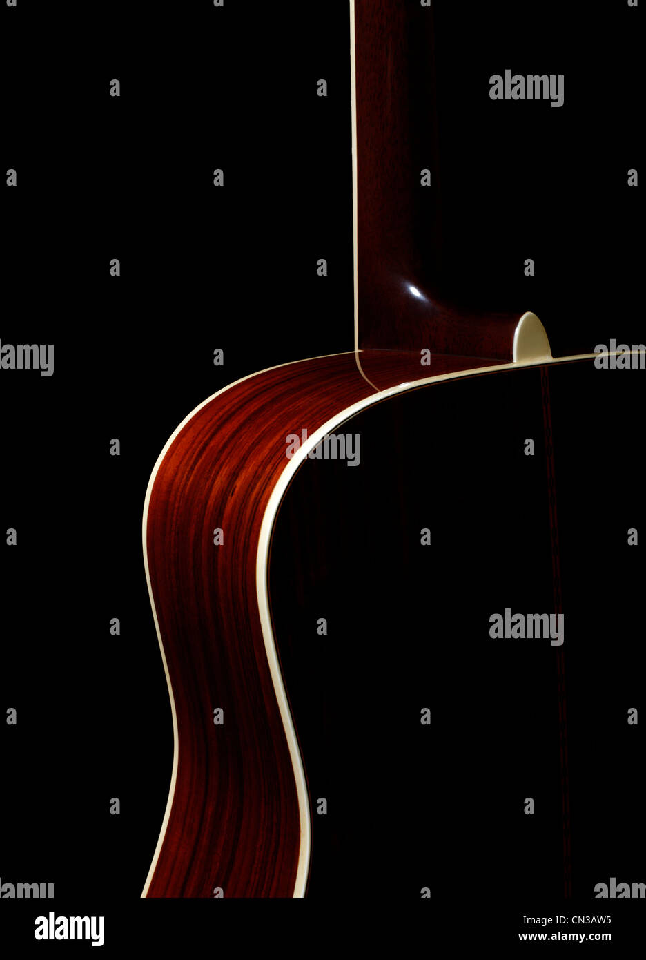 Acoustic guitar against black background Stock Photo