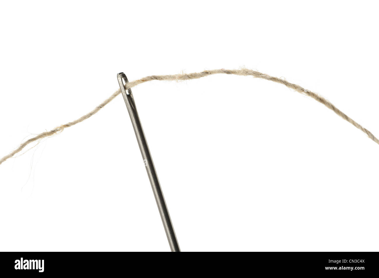 Needle and thread closeup. Isolated on white background Stock Photo Alamy