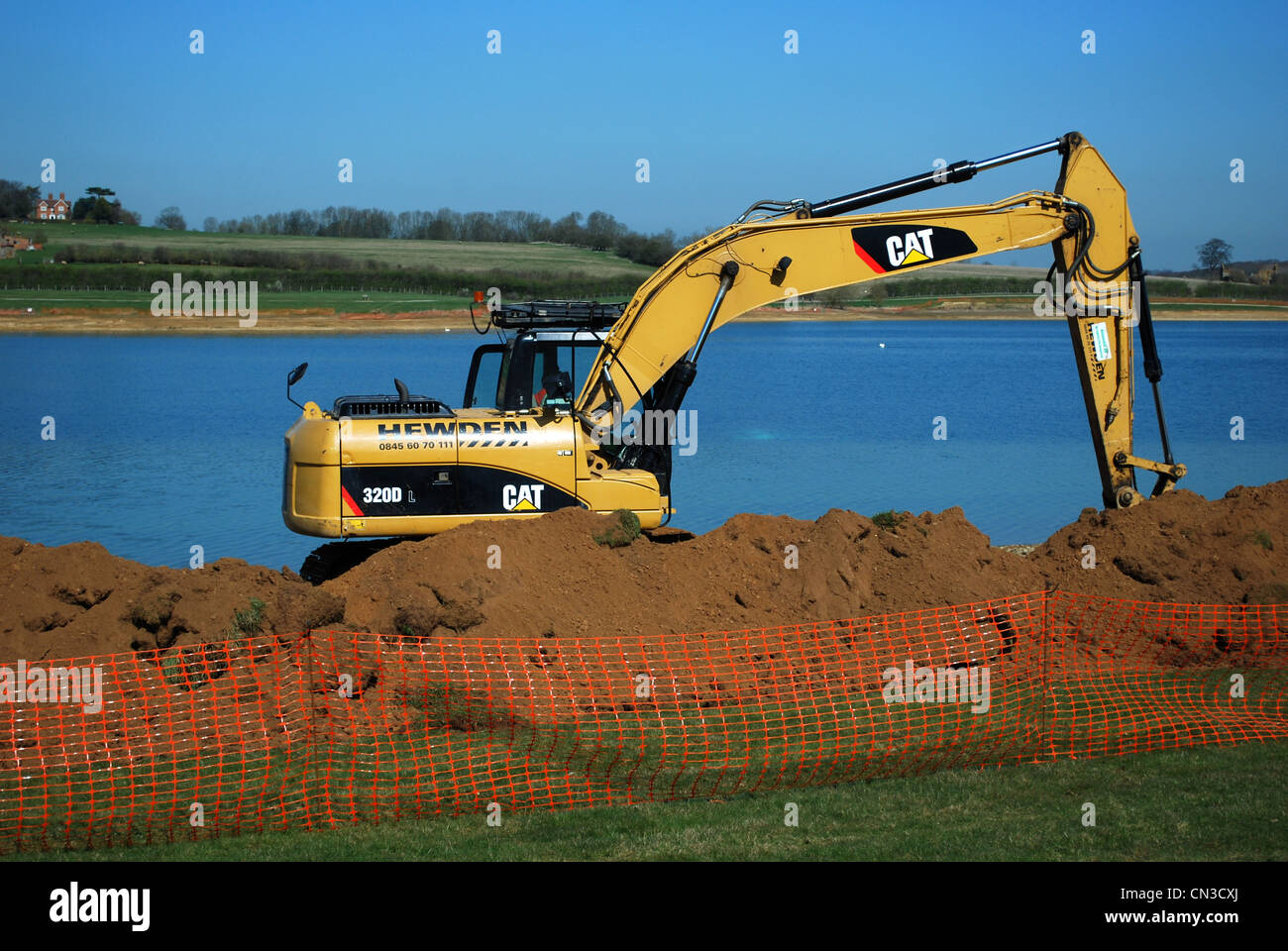 A cat digger at Pitsford reservoir Northamptonshire Stock Photo Alamy