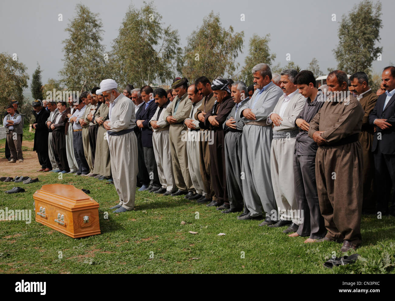An imam is preparing funeral notice of a woman in Halabja, Iraqi Kurdistan Stock Photo
