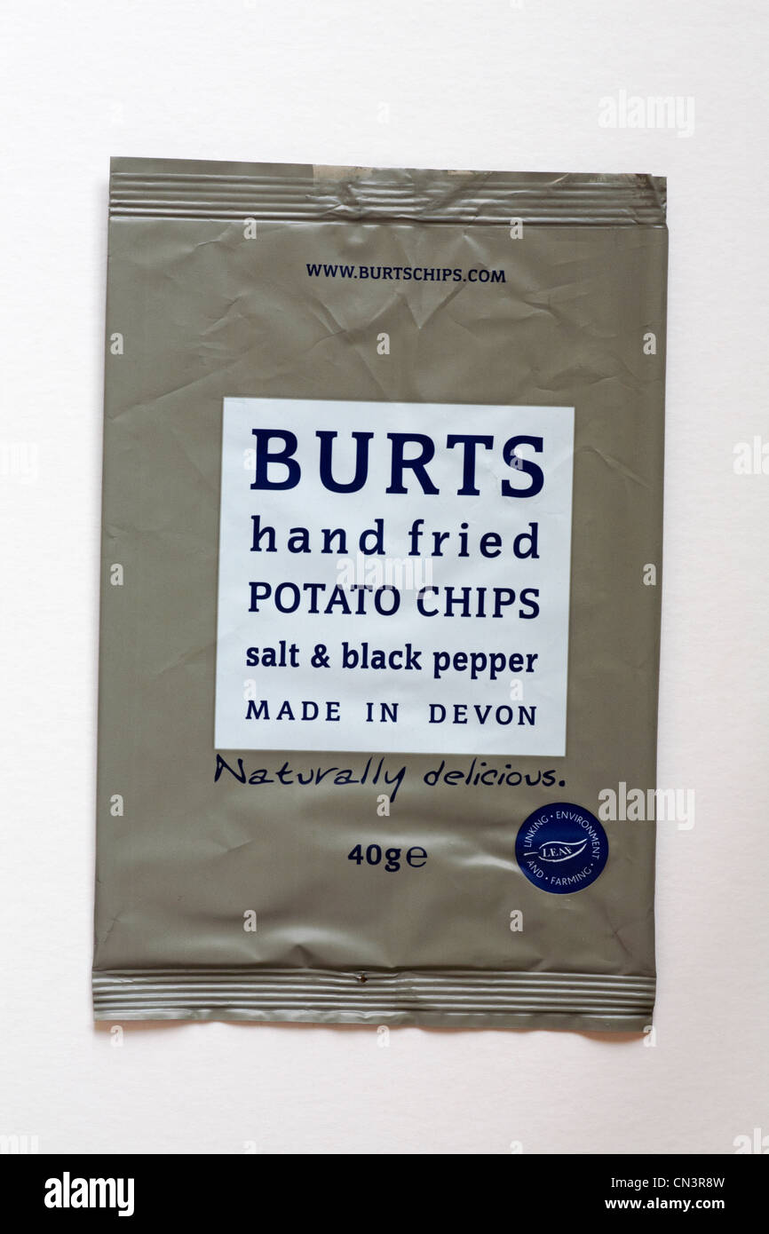 empty packet of Burts hand fried potato chips salt & black pepper flavour crisps isolated on white background - naturally delicious made in Devon Stock Photo