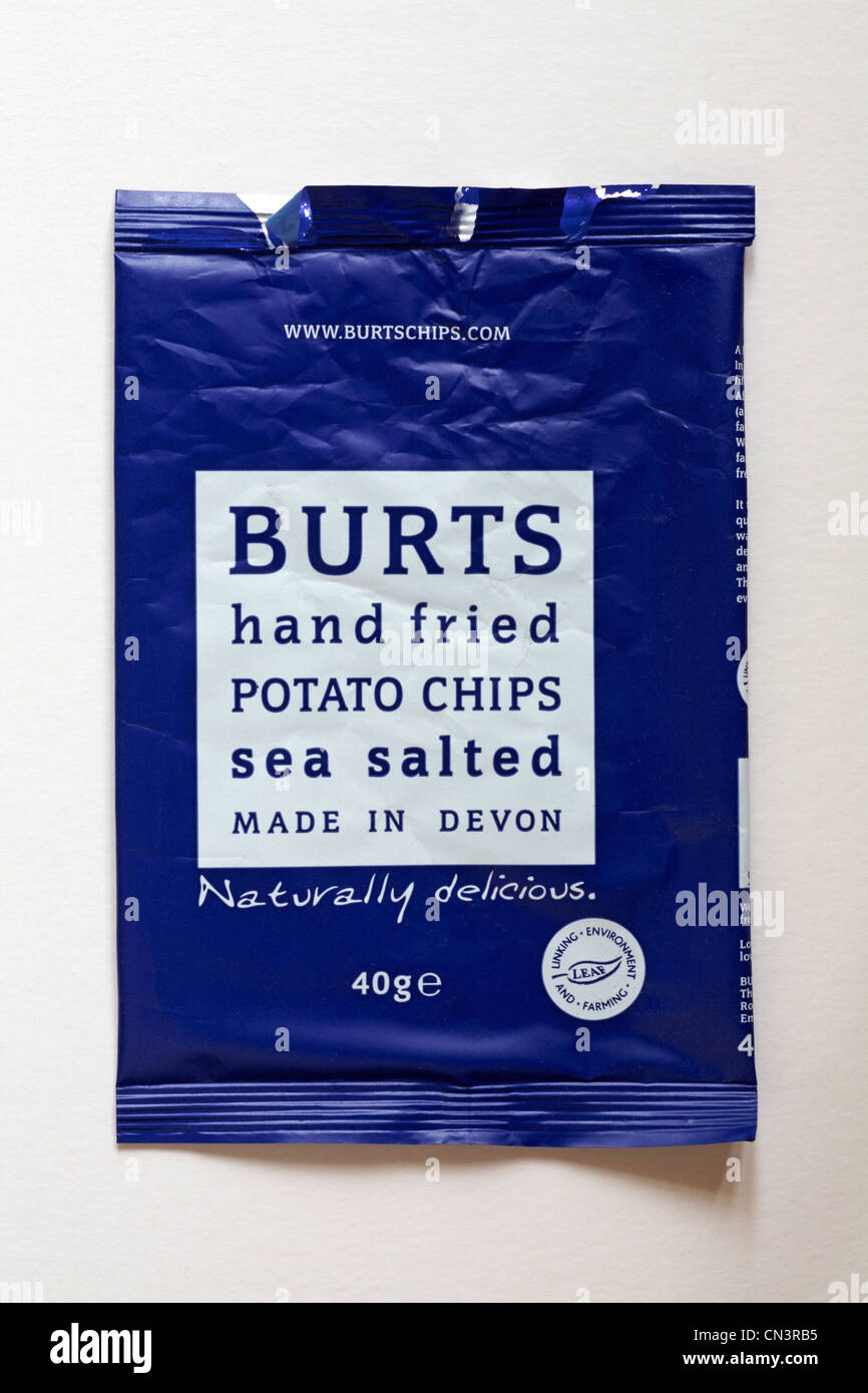 empty packet of Burts hand fried potato chips sea salted flavour crisps isolated on white background - naturally delicious made in Devon Stock Photo