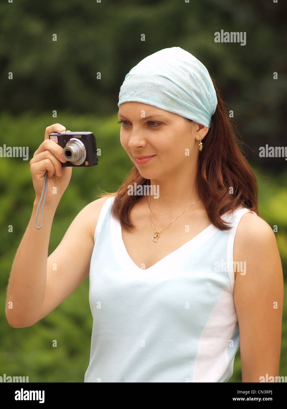 Girl with camera Stock Photo - Alamy
