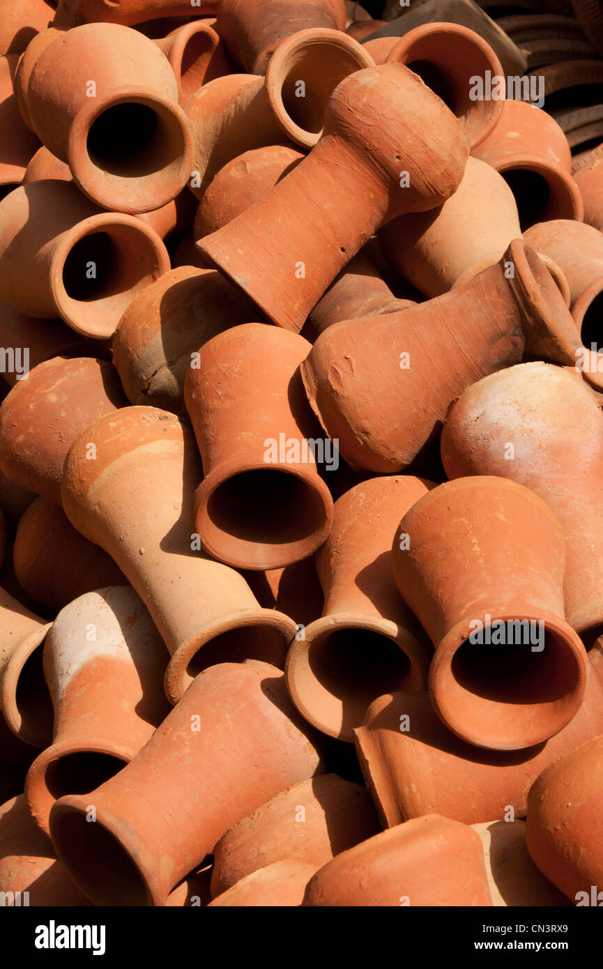 Small pots inside a garden, located in the nursery and ready for