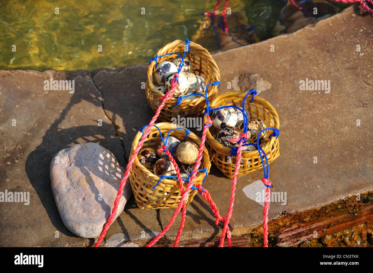Bird's eggs in baskets, at Wieng Pa Pao hot spring at Chiang Rai, Chiang Rai Province, Thailand Stock Photo