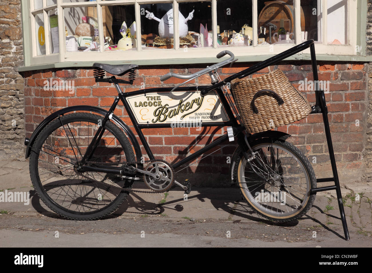 The Lacock Bakery bicycle , Wiltshire, England, UK Stock Photo