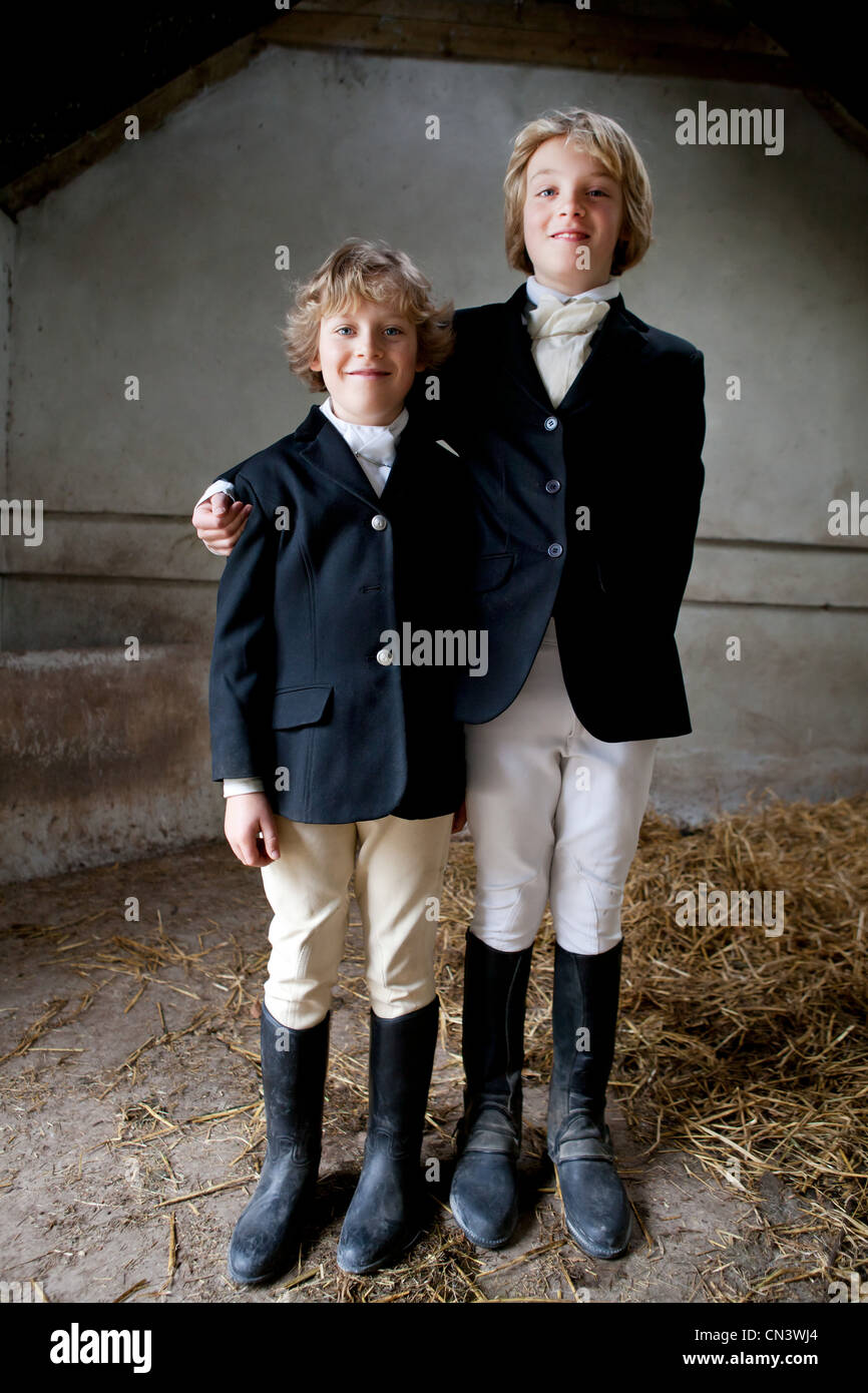 Portrait of boys wearing horse riding clothes Stock Photo
