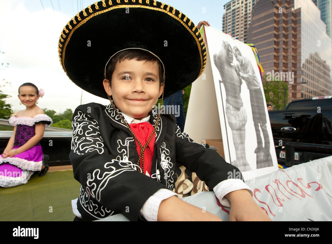 Young boy in traditional Mexican Charro attire rides on parade float in  Austin, Texas Stock Photo - Alamy