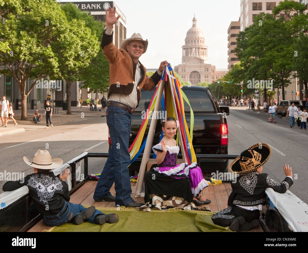 Laredo artist Armando Hinojosa in parade to Texas Capitol. His Tejano