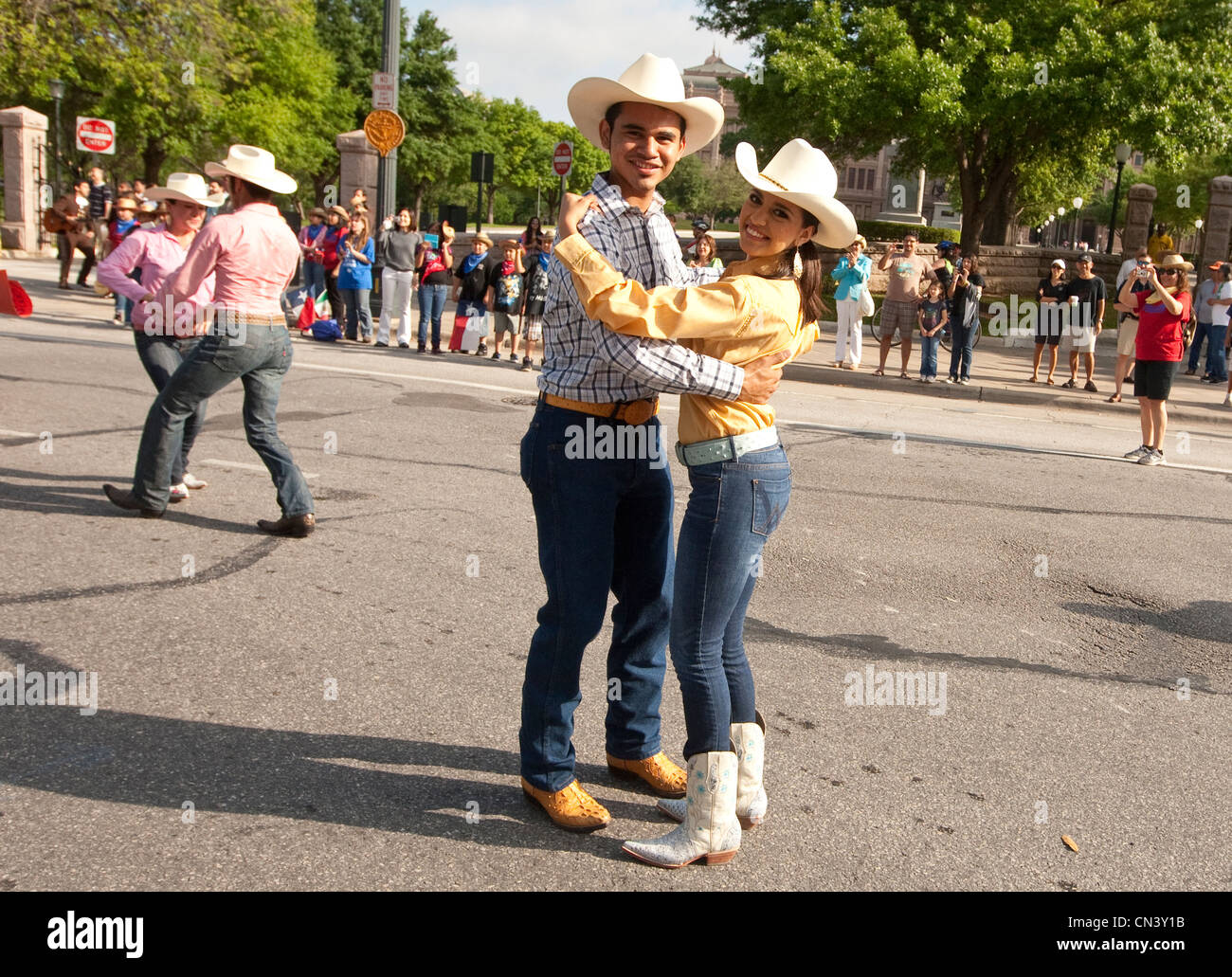 Young members of student Ballet Folklorico perform dance  traditional Norteño clothing from Northern Mexico during a parade Stock Photo